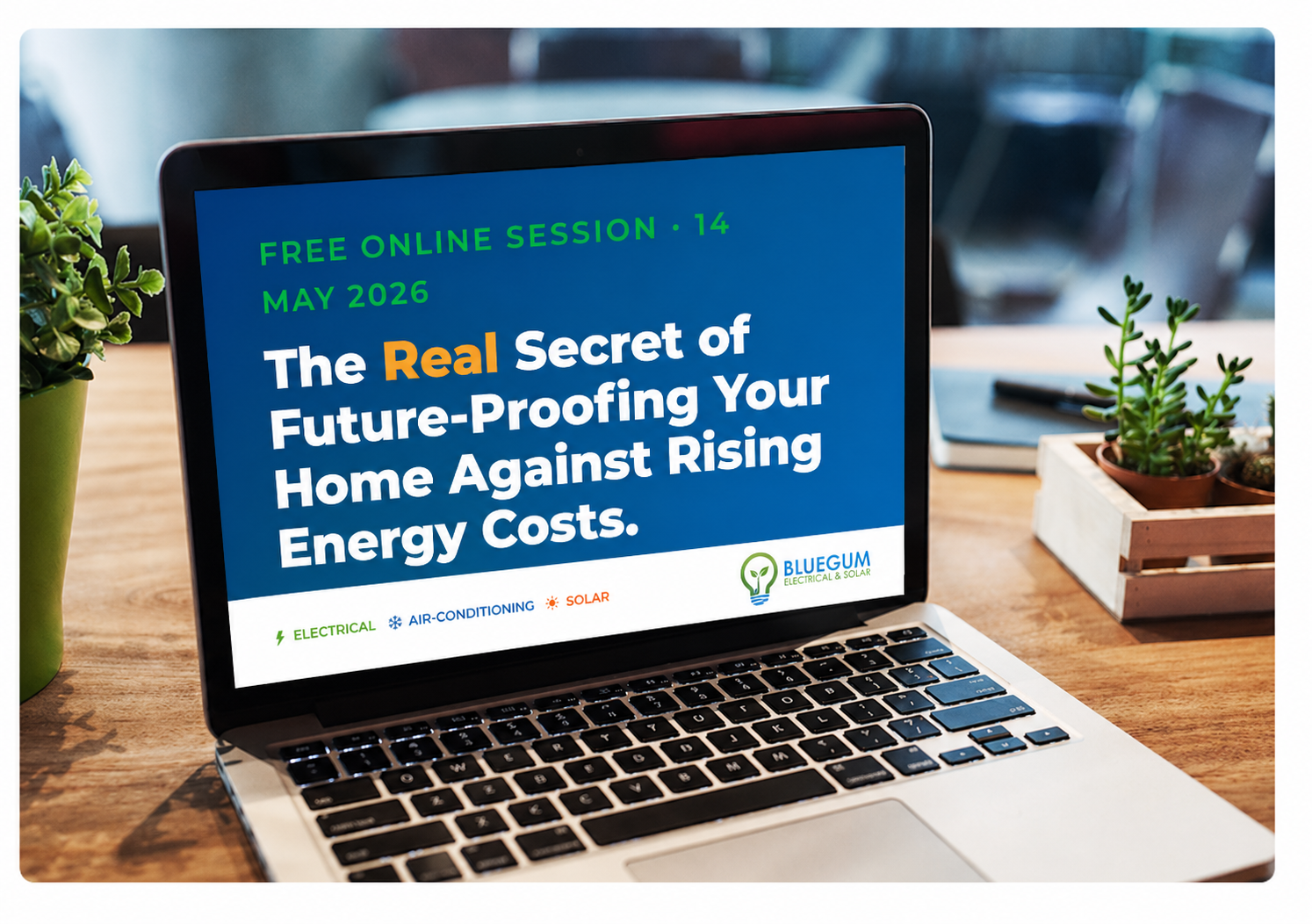 Laptop on a wooden desk with the Real Secret session title slide on screen